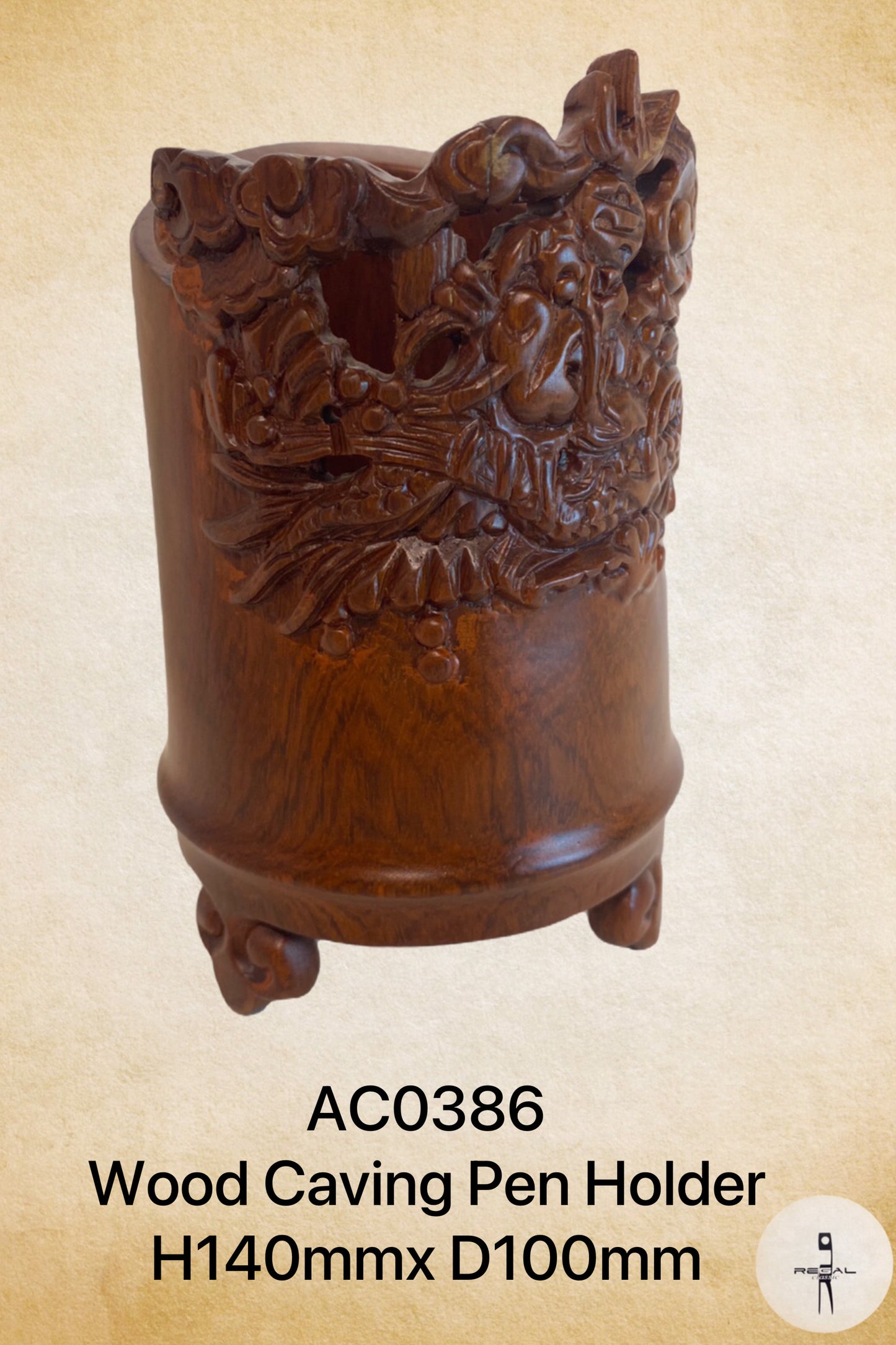 A wooden pen holder with a carved floral and animal pattern.