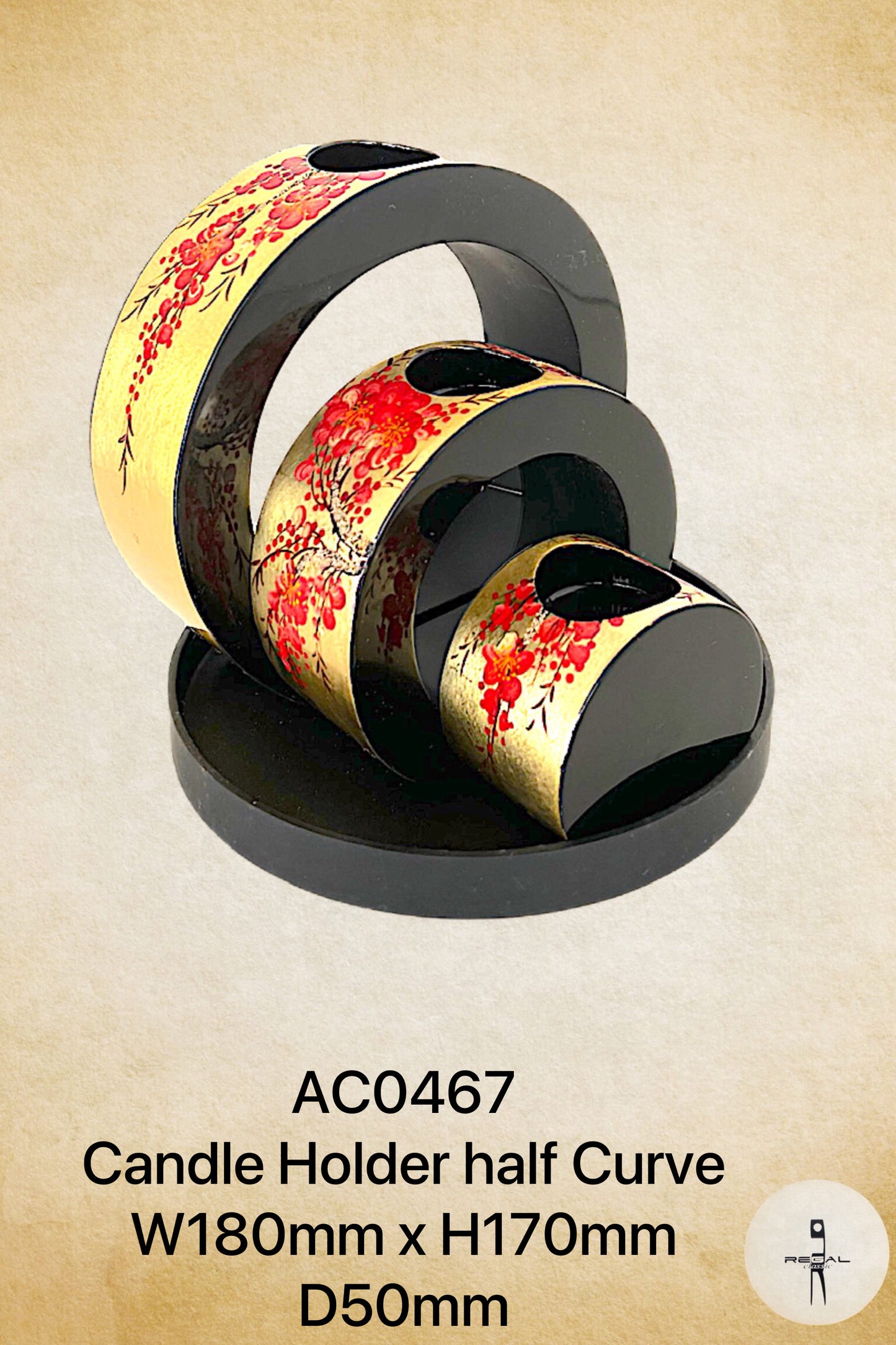 A black and gold colored candle holder with a floral pattern.