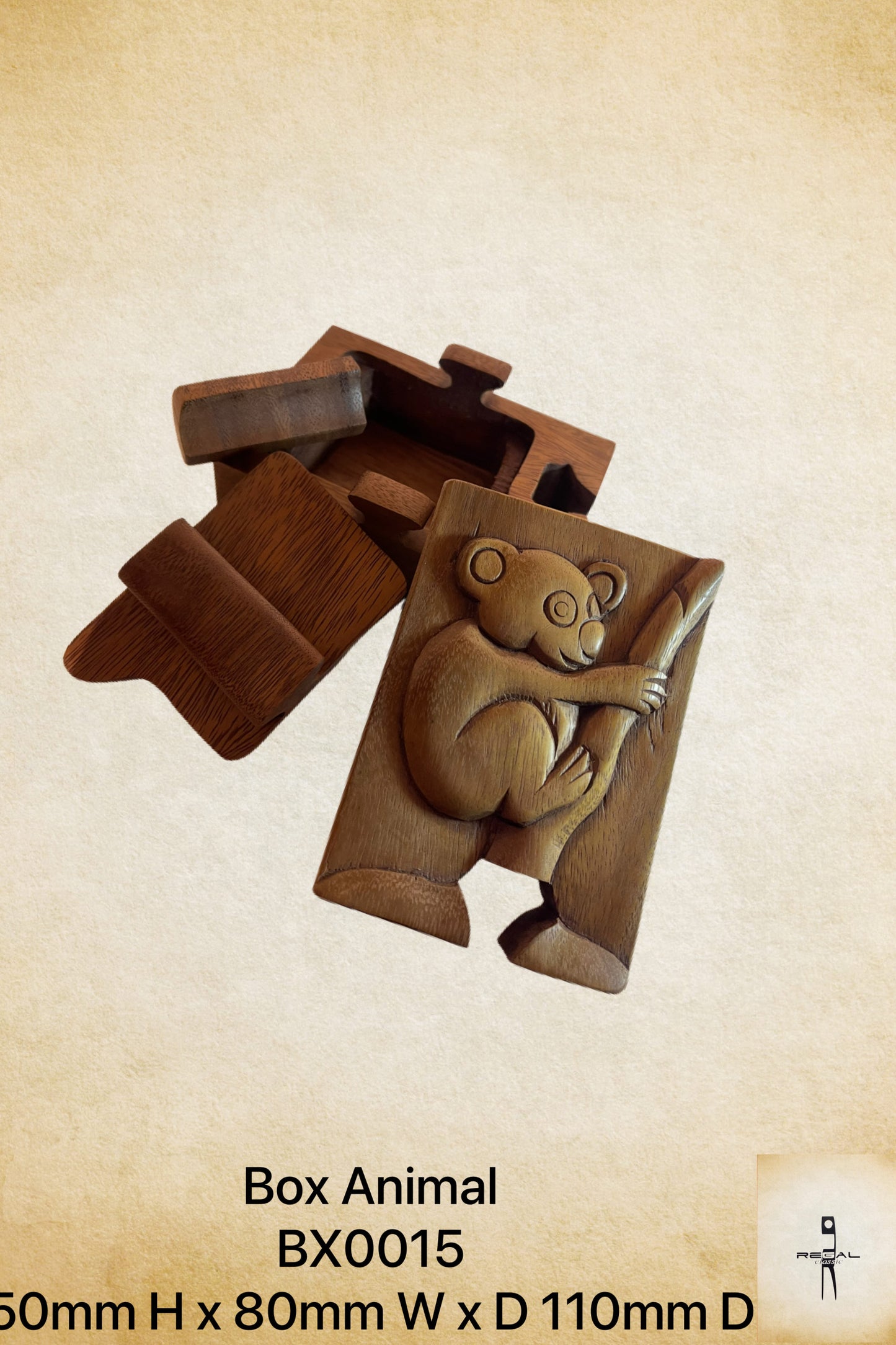 A wooden storage box designed to resemble a koala bear, with detailed carvings.