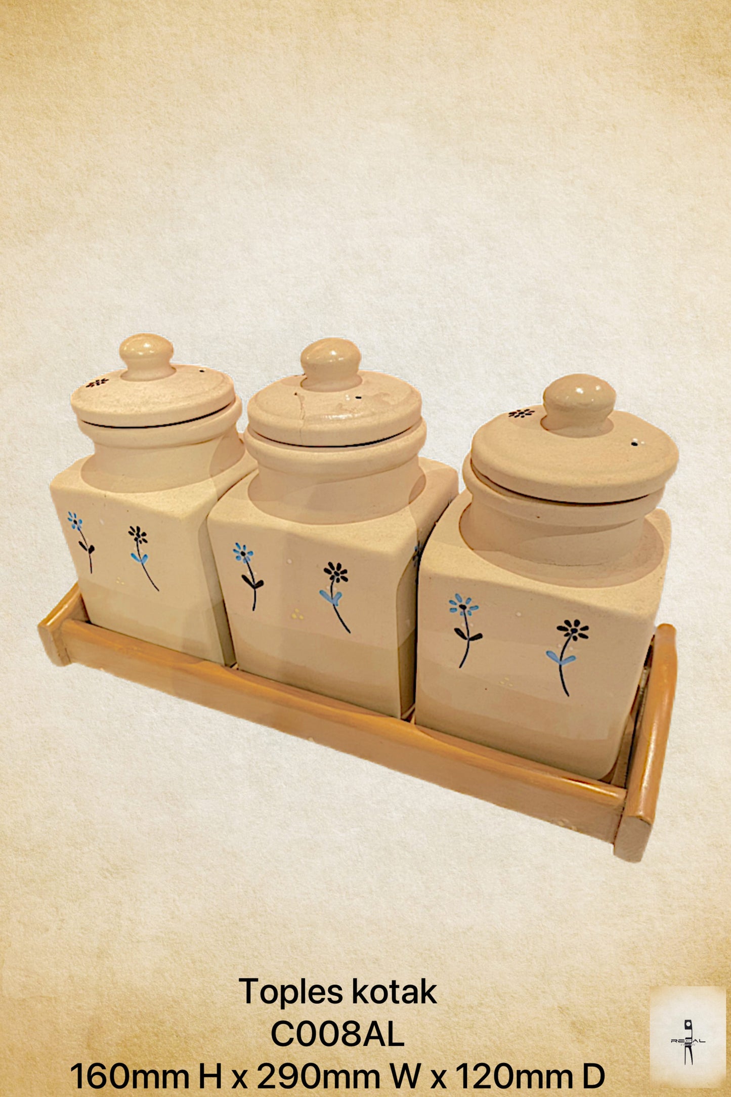 A set of three beige ceramic jars with blue floral patterns and lids, displayed on a wooden shelf.