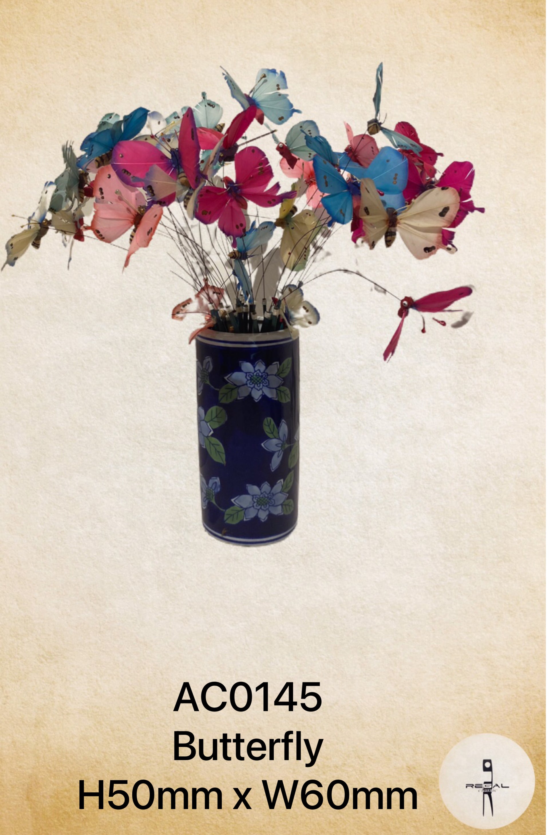A decorative vase with a floral pattern and butterfly accessories.