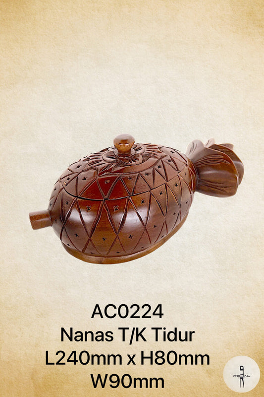 A wooden music box in the shape of a fruit with a domed lid and a side handle.