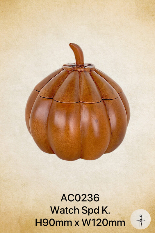 A brown, pumpkin-shaped watch stand with a handle on top