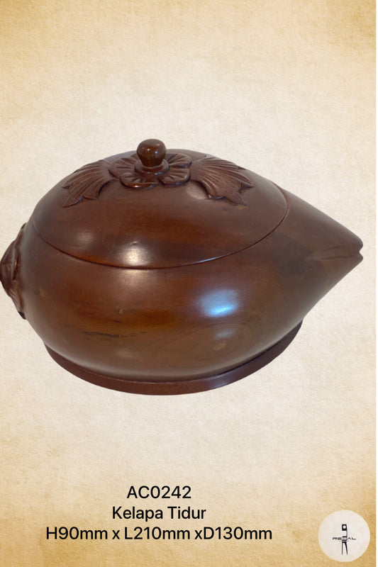A brown, handicraft bowl with a floral pattern, made of wood