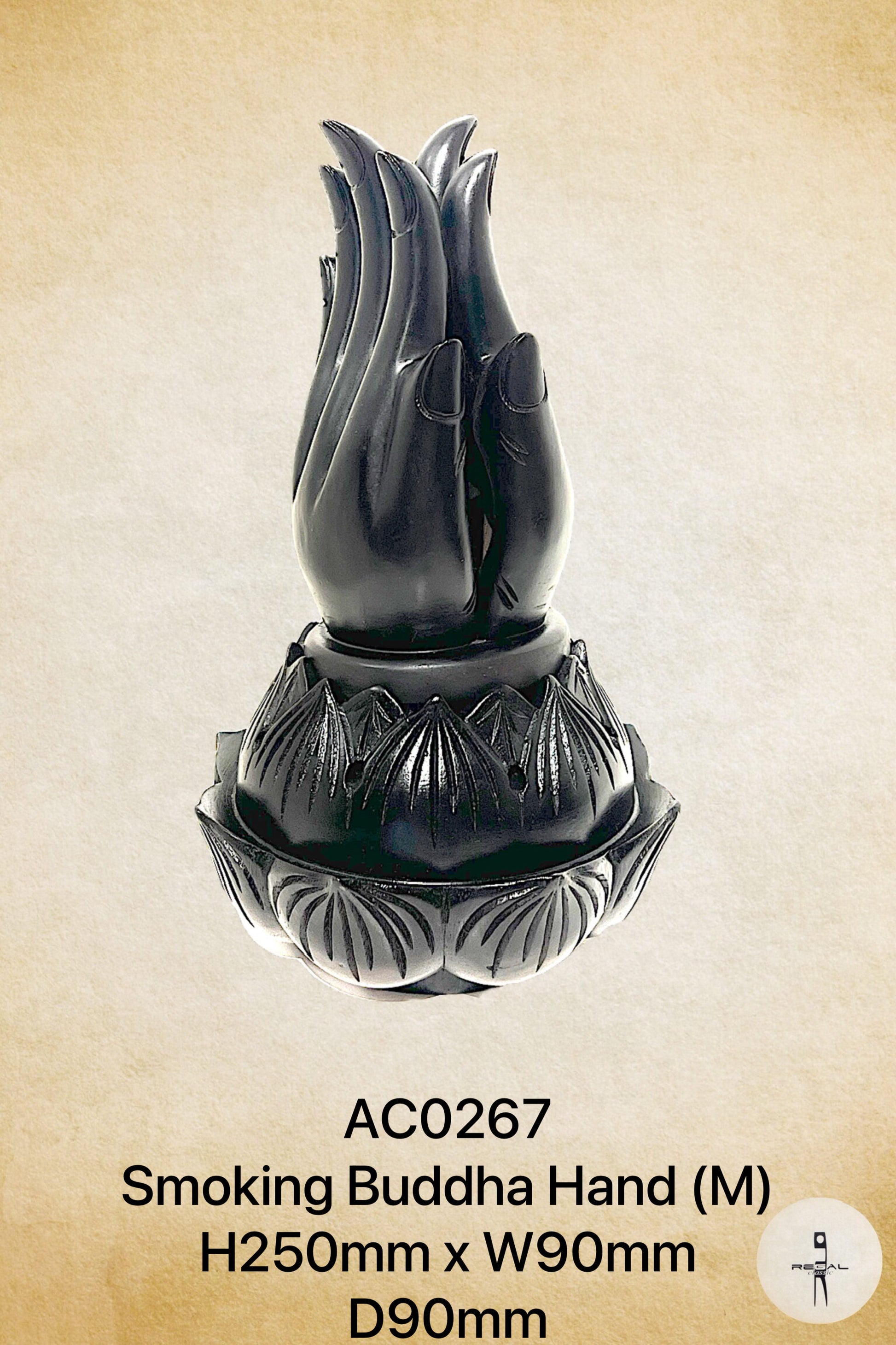A black stone sculpture of a buddha hand, with a base and detailed carvings.