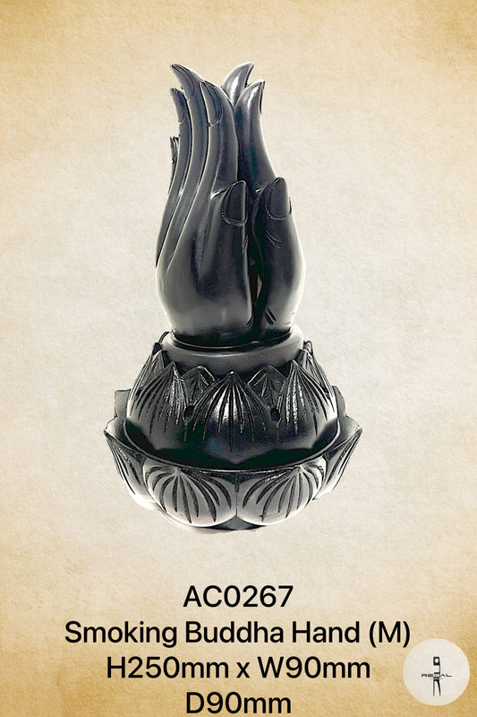 A black stone sculpture of a buddha hand, with a base and detailed carvings.