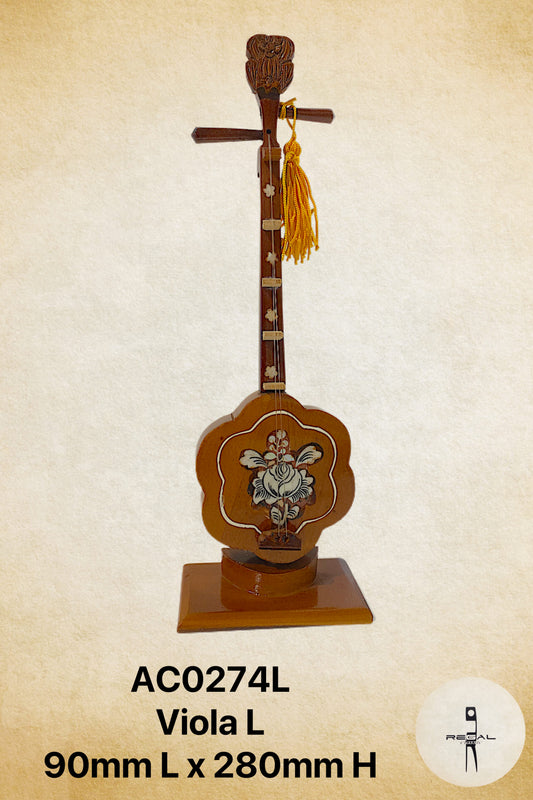 A wooden viola-shaped display piece with a decorative element on top, used for musical or cultural purposes.