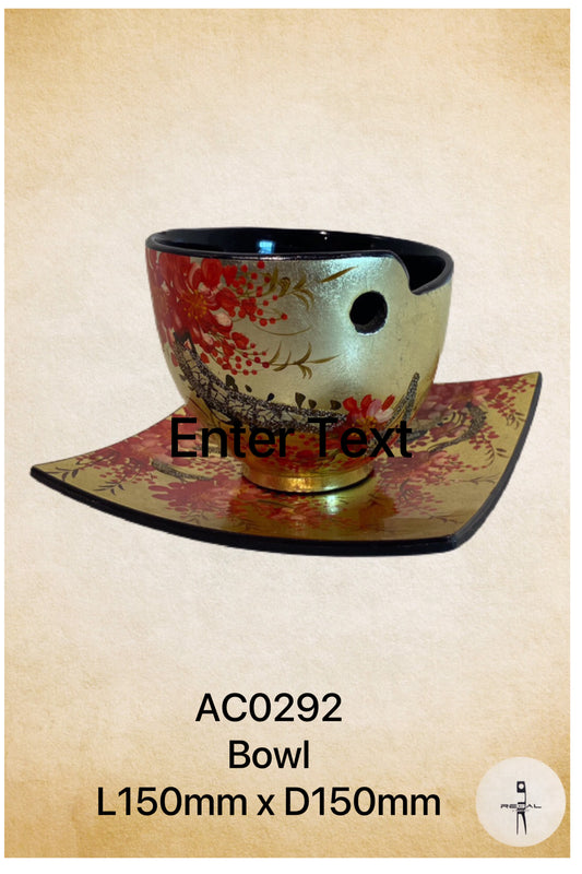 A decorative ceramic bowl with a floral pattern in red, gold, and black colors