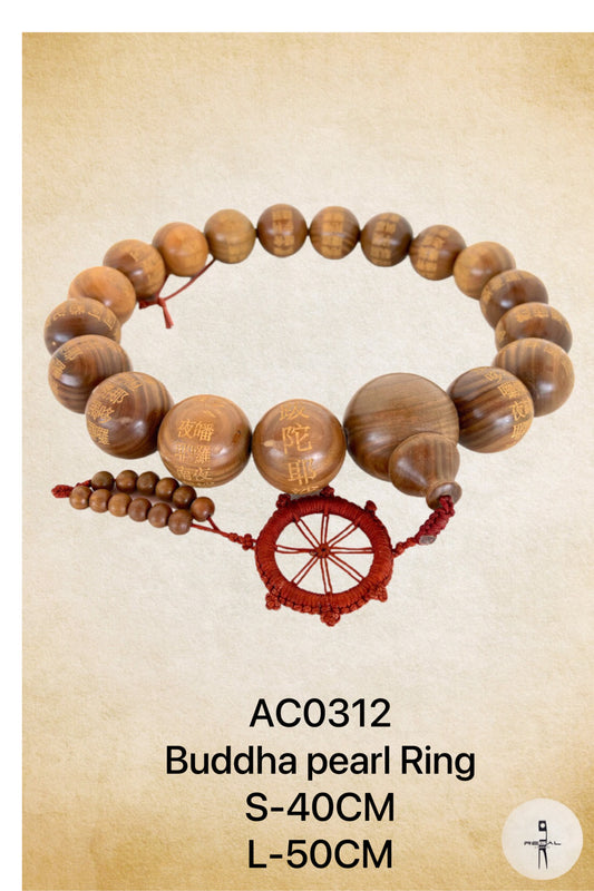 A Buddha pearl ring with wooden beads and a red braided cord, displayed against a textured background.