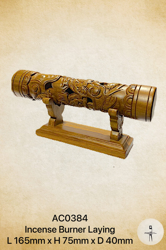 A wooden incense burner designed to resemble a cannon, with intricate carvings and a base for stabilization.