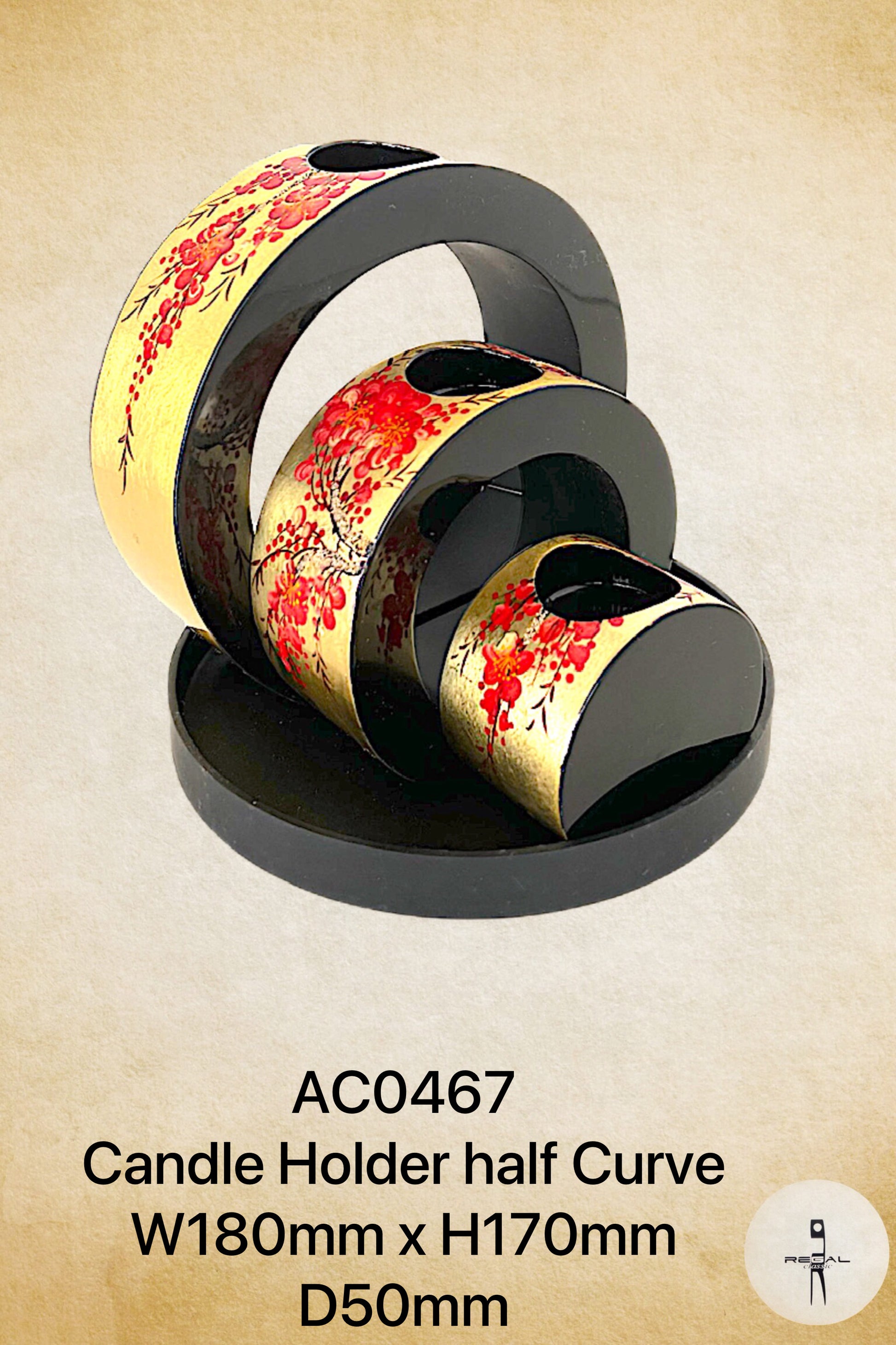 A black and gold colored candle holder with a floral pattern.