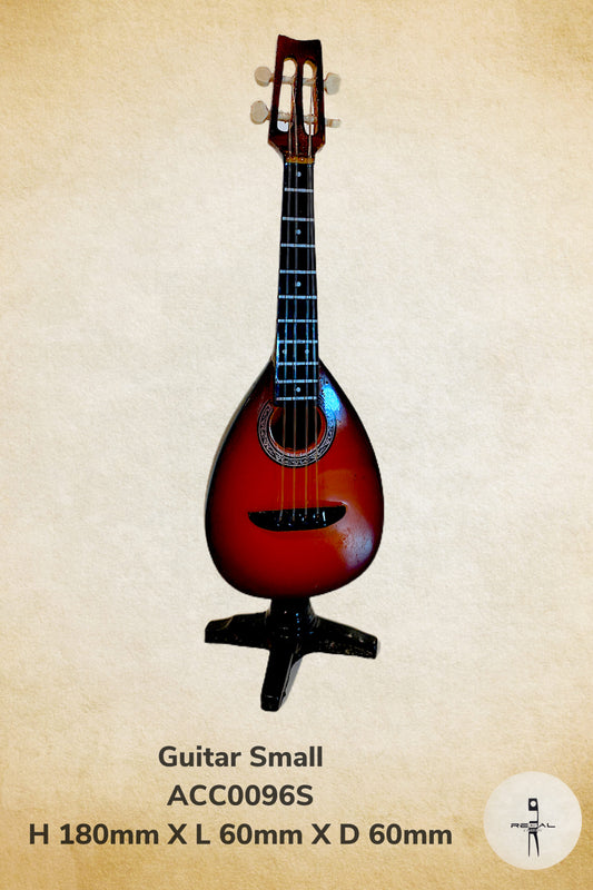 A small red and brown guitar with a black pickguard