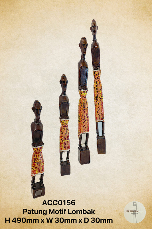 Wooden statue with decorative red and yellow fabric belts.