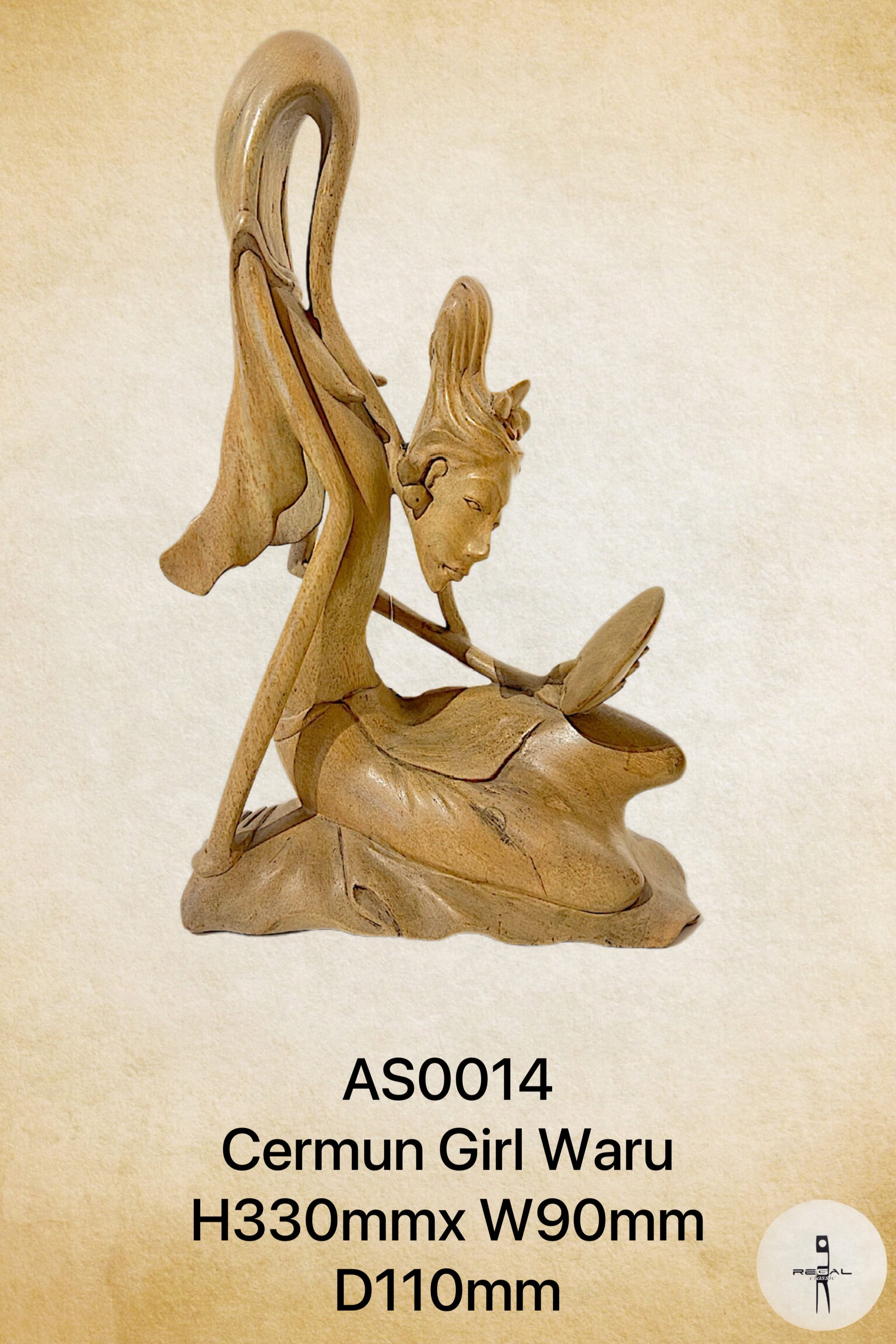 A wooden sculpture of a female figure with flowing hair, seated with a book.