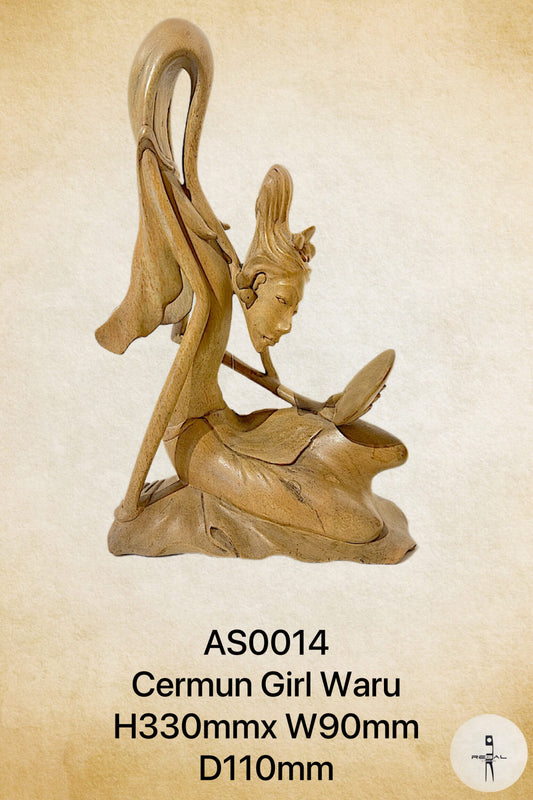 A wooden sculpture of a female figure with flowing hair, seated with a book.