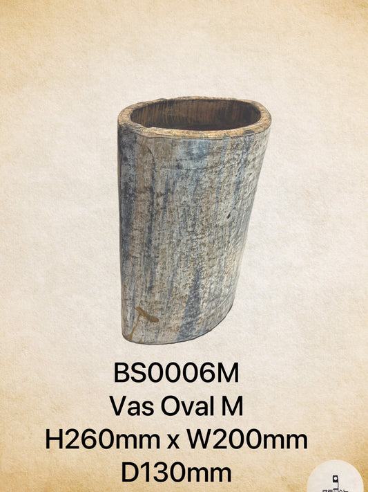 A beige and gray ceramic oval-shaped incense holder with a rustic appearance.