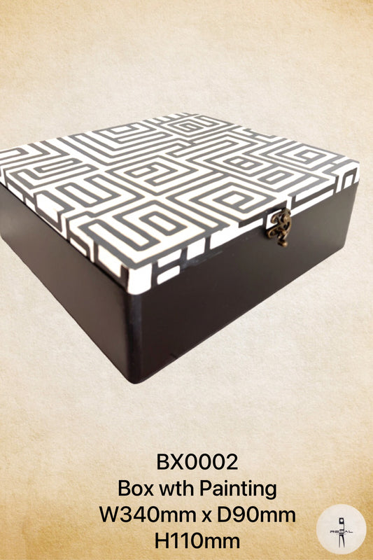 A black and white geometric patterned music box with a lid and a clasp.